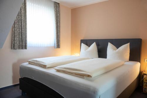 Katil atau katil-katil dalam bilik di Mittelrhein Pension