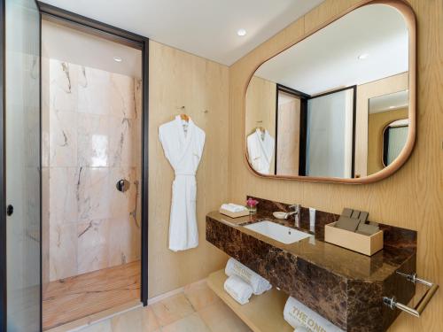 a bathroom with a sink and a mirror at The One Palácio da Anunciada in Lisbon