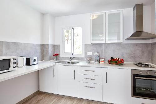 Kuchyň nebo kuchyňský kout v ubytování Sonrisa Apartments