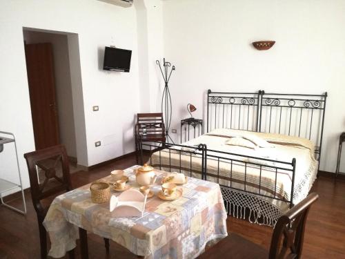Una cama o camas en una habitación de Li Traìni