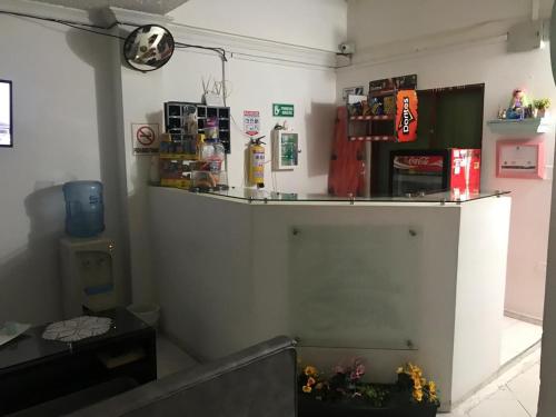 a room with a counter and aperature at Hotel SION in Pitalito