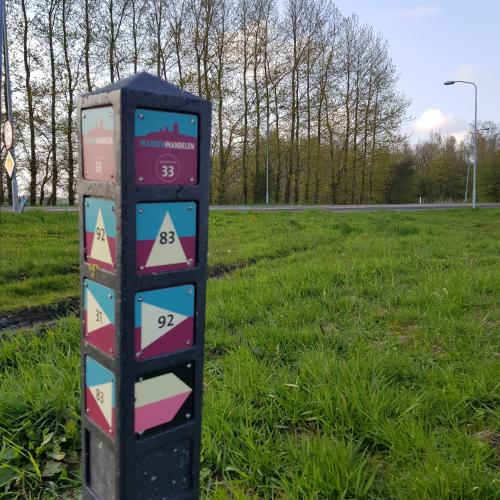 a parking meter in the grass in a field at Op de Bult in Rasquert