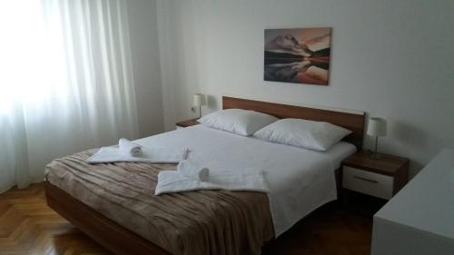 Postel nebo postele na pokoji v ubytování Apartman Teklić