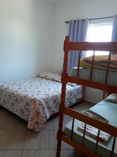 a bedroom with a bunk bed and a ladder at Apartamentos de Penha in Penha