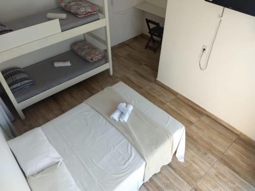 Postel nebo postele na pokoji v ubytování Pousada Petunia's