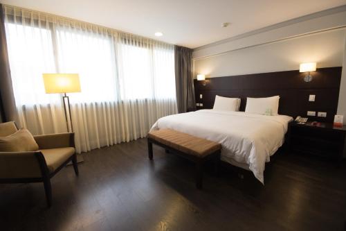 Ein Bett oder Betten in einem Zimmer der Unterkunft Unipark by Oro Verde Hotels