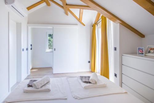 Кровать или кровати в номере Holiday House Kleme