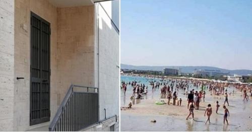 a large group of people on a beach at Blue Sea Apartment in Torre Canne