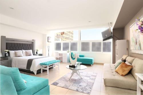 a living room with a bed and a couch at Premier apartment in the heart of Mexico 802 in Mexico City
