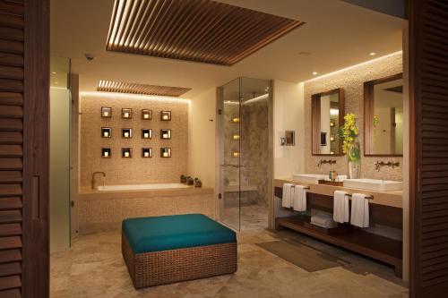 a bathroom with a tub and a sink at Secrets Maroma Beach Riviera Cancun - Adults only in Playa del Carmen