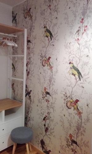 a wall mural of birds on a wall at LA CASA DI GLADYS in Lecco