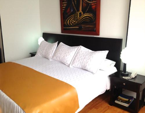 Ένα ή περισσότερα κρεβάτια σε δωμάτιο στο Hotel Ferrovial Corferias