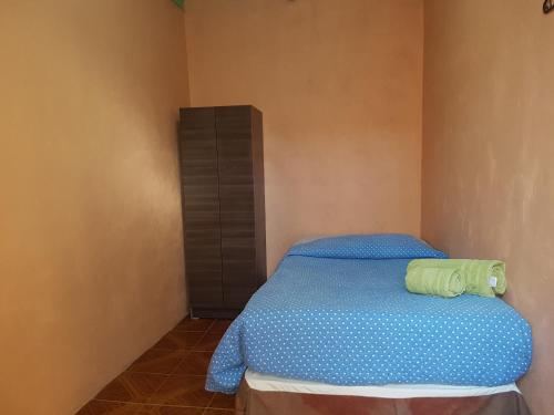 Кровать или кровати в номере Hostal Tuyasto