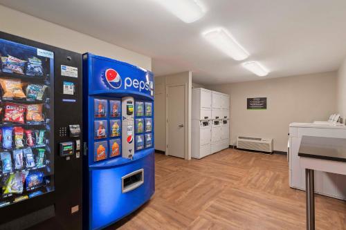 a room with a pepsi vending machine in a store at Extended Stay America Suites - Charlotte - University Place in Charlotte