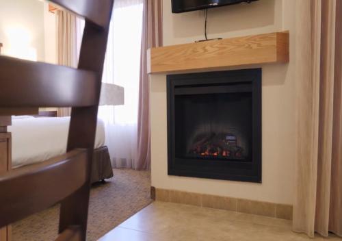 a fireplace in a hotel room with a fire place at Bell Rock Inn in Sedona