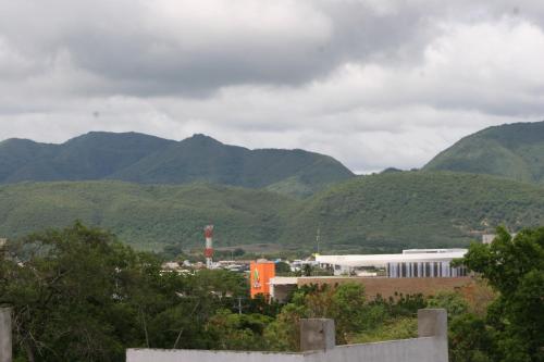 a view of a city with mountains in the background at Mirador de San Jorge in Girardot