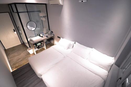 Кровать или кровати в номере Rest Chinatown Hotel
