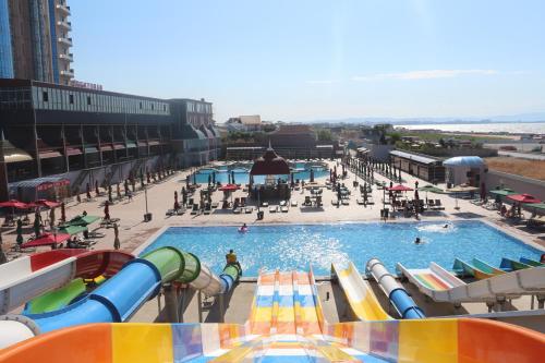 an indoor water park with a water slide at Spring Hotel in Novxanı