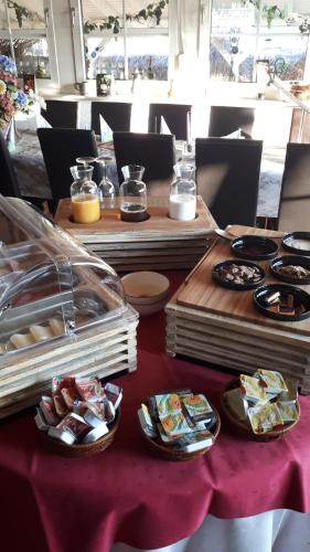 a table topped with a variety of pastries at Hotel Restaurant Anna in Ramstein-Miesenbach