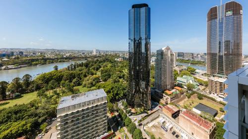 an aerial view of a city with a tall building at Oaks Brisbane on Margaret Suites in Brisbane