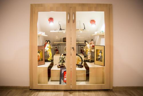 a display case in a room with action figures at Pensiunea SilvAnka in Vîlcele