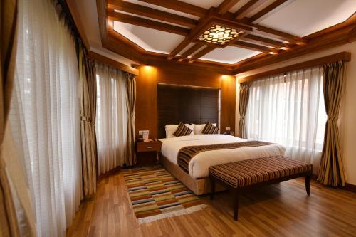 a bedroom with a large bed in a room at Park Village Resort by KGH Group in Kathmandu