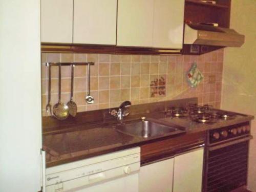 a kitchen with a sink and a counter top at Bordighera centro molto tranquillo in Bordighera