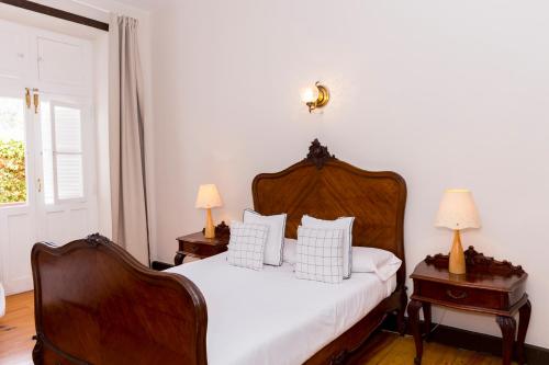 En eller flere senge i et værelse på Emblemático Hotel Madrid