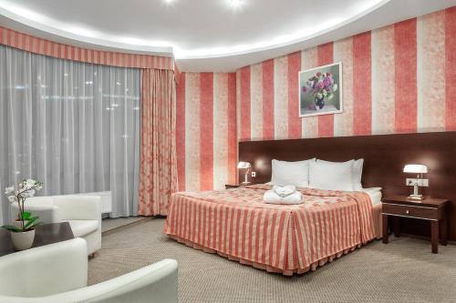 Кровать или кровати в номере Гостиница Николь