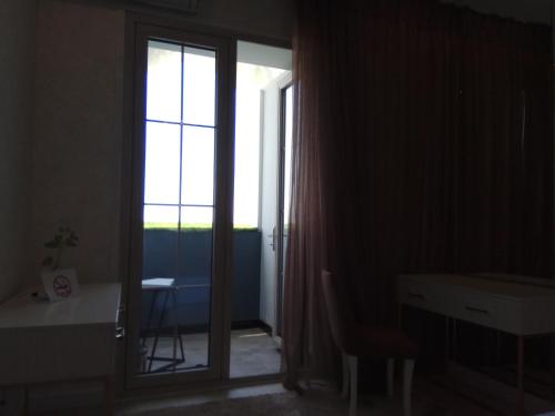 a room with a door with a window and a desk at Apartments on Shevchenko in Tashkent
