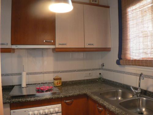 a kitchen with a sink and a counter top at Mas Pinell 129 in Torroella de Montgrí