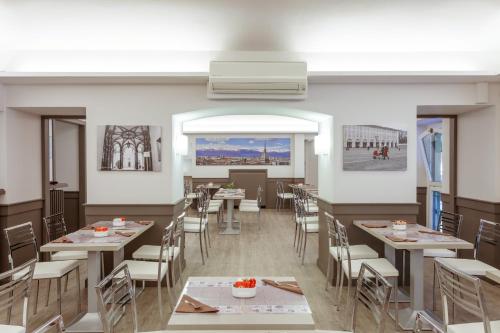 a rendering of a restaurant with tables and chairs at Best Quality Hotel Dock Milano in Turin