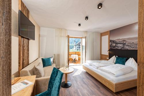 Кровать или кровати в номере Hotel Schallerhof