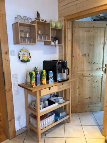 a kitchen with a table with a microwave on it at Haus Annabelle in Wagrain
