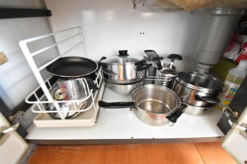 a bunch of pots and pans sitting on a stove at CRAFT in Matsubara