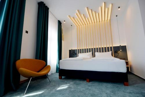 Ένα ή περισσότερα κρεβάτια σε δωμάτιο στο Kleines Hotel