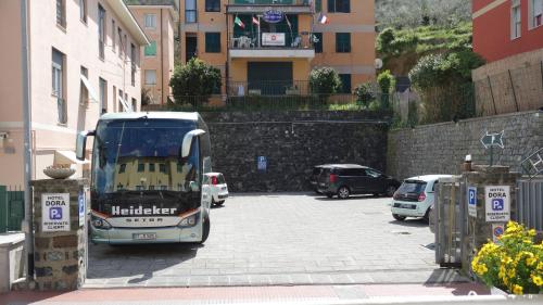 a bus is parked in a parking lot at Hotel Dora in Levanto