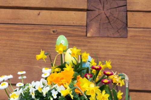a bunch of flowers in a vase on a table at Chata Hrozenka WELLNESS in Nový Hrozenkov