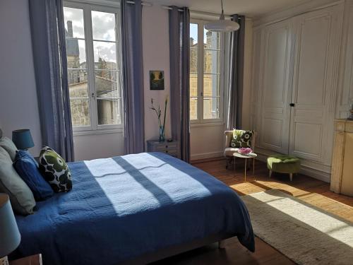 Säng eller sängar i ett rum på Maison de Maître Elegia