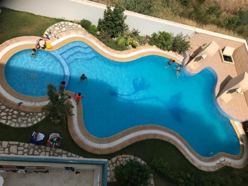 an overhead view of a swimming pool at a resort at DIAR EL FELL - Route Touristique - Chatt Meryem / Port El Kantaoui in Sousse