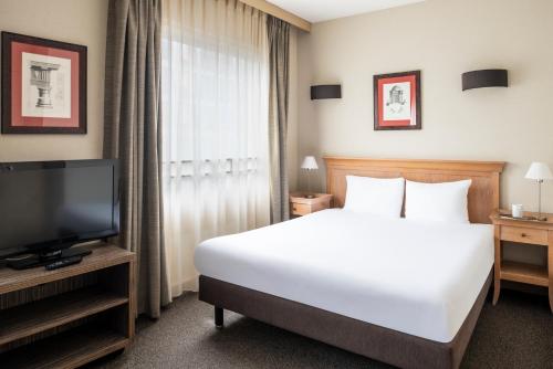 Postel nebo postele na pokoji v ubytování Aparthotel Adagio La Défense Esplanade