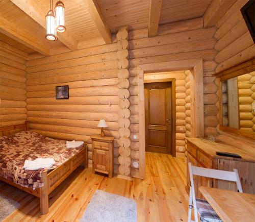 Ένα ή περισσότερα κρεβάτια σε δωμάτιο στο Gans Hotel