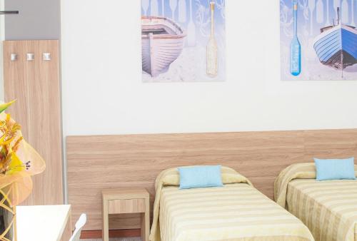 Un ou plusieurs lits dans un hébergement de l'établissement Hotel Solmar