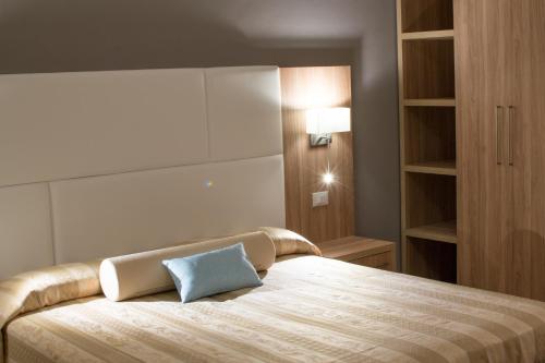 Un ou plusieurs lits dans un hébergement de l'établissement Hotel Solmar