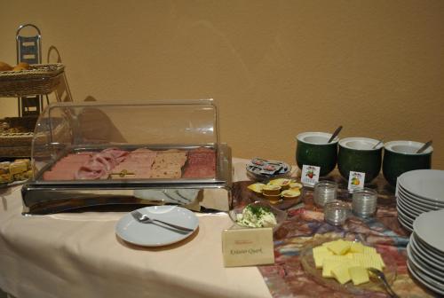 a table with a buffet of food on it at Landgasthof Fleischhauer in Büßfeld
