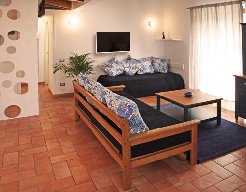 a living room with a couch and a table at Casa Fabiana in Sorrento