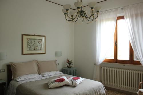 Ένα ή περισσότερα κρεβάτια σε δωμάτιο στο B&B Il Giardino Di Isa