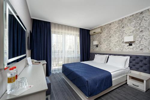 Eurohotel tesisinde bir odada yatak veya yataklar