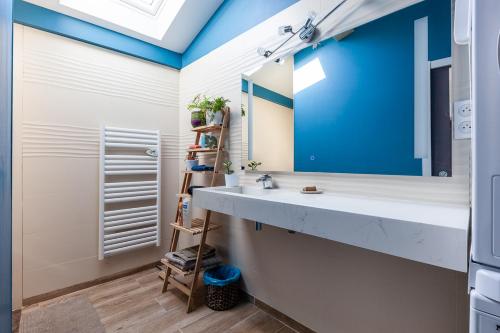 a bathroom with a sink and a mirror at Alpinias Bed and Breakfast in Marseille