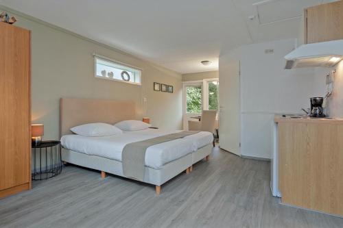 Ένα ή περισσότερα κρεβάτια σε δωμάτιο στο Hotel Randduin